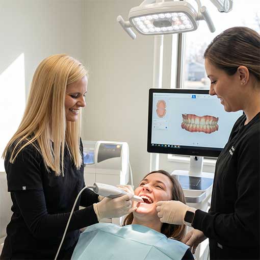 Dr. Elizabeth Osterday gently consulting with a patient, displaying her attentive and patient-first philosophy.