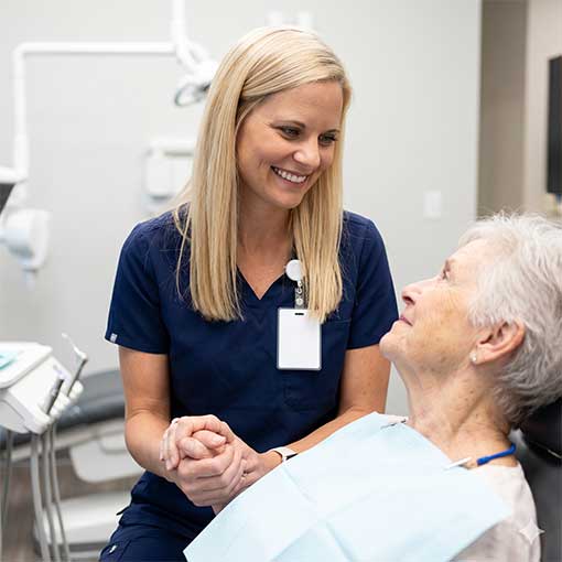 Dr. Elizabeth Osterday interacting compassionately and gently with a patient during a visit.